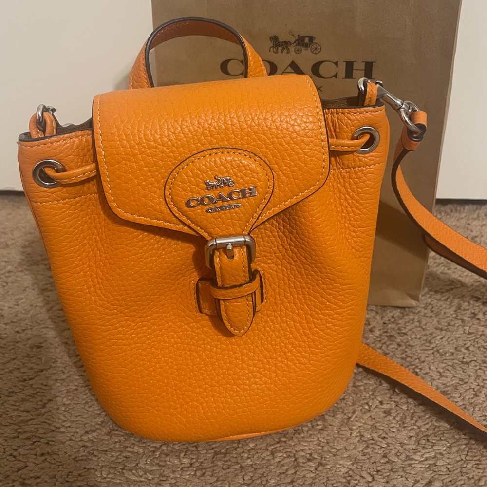 Coach purse that can also be a miniature backpack